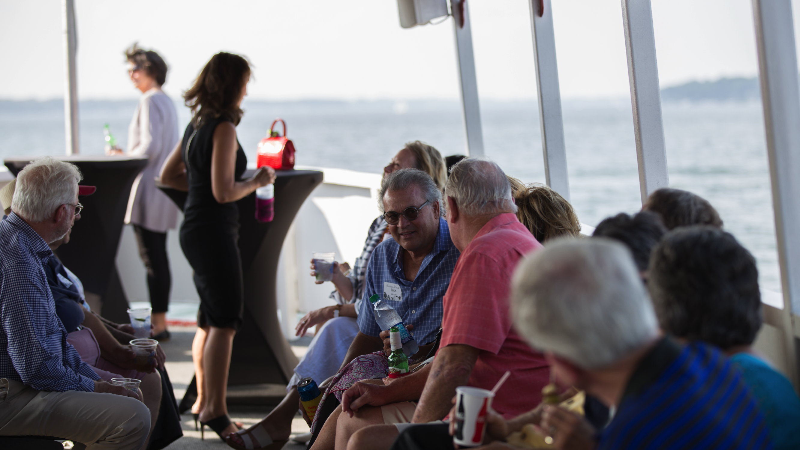 A young girl riding a tiger on the carousel.