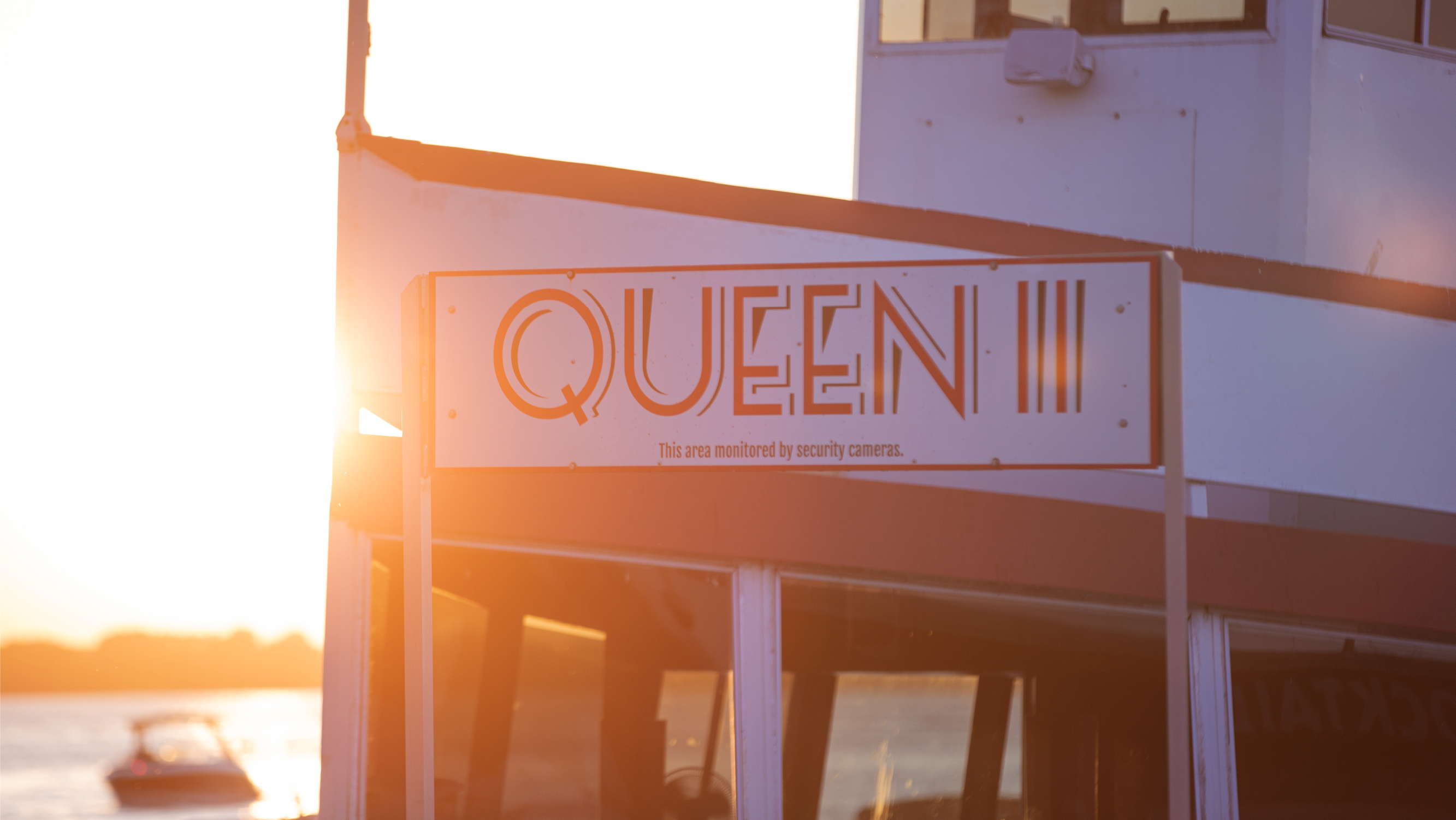 A young girl riding a tiger on the carousel.